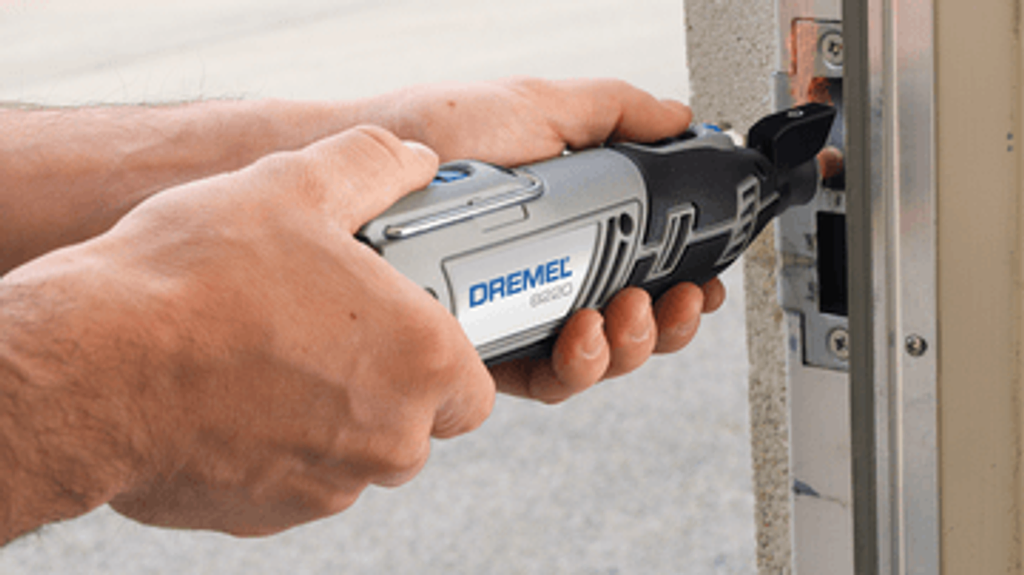 Dremel cordless Multi-tool 12V Li-ion used to repair a door. Affordable rental with BIYU.