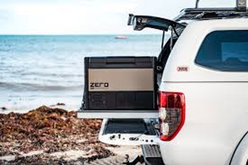 ARB Portable Electronic Freezer in a car with open trunk. Affordable rental with BIYU.