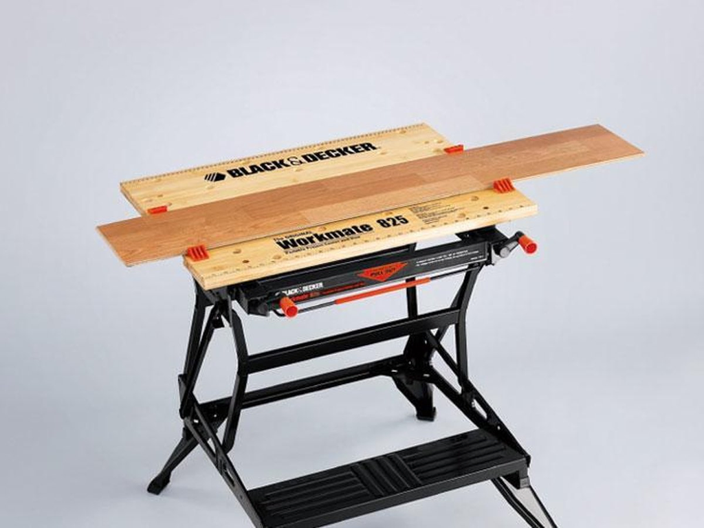 Black & Decker foldable work bench with a wooden plank on it. Affordable rental with BIYU.
