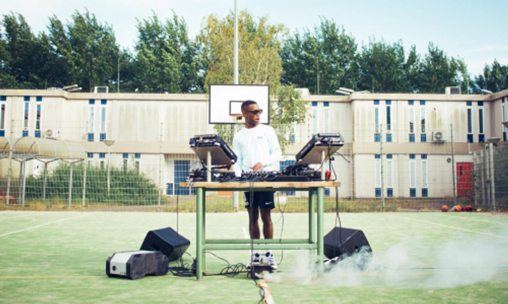  A man using the Wattsun dock to power his DJ set
