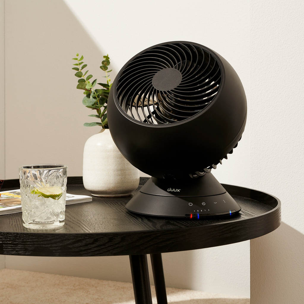 Duux Globe Black that sits on bed table and cools bedroom, rent at BIYU. 
